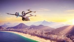 Conceito de carro voador da Embraer sobrevoando cidade do Rio de Janeiro