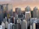 Imagem aérea de prédios de frente com céu nublado em final de tarde em São Paulo, alusivo à carteira de fundos imobiliários do Safra para novembro